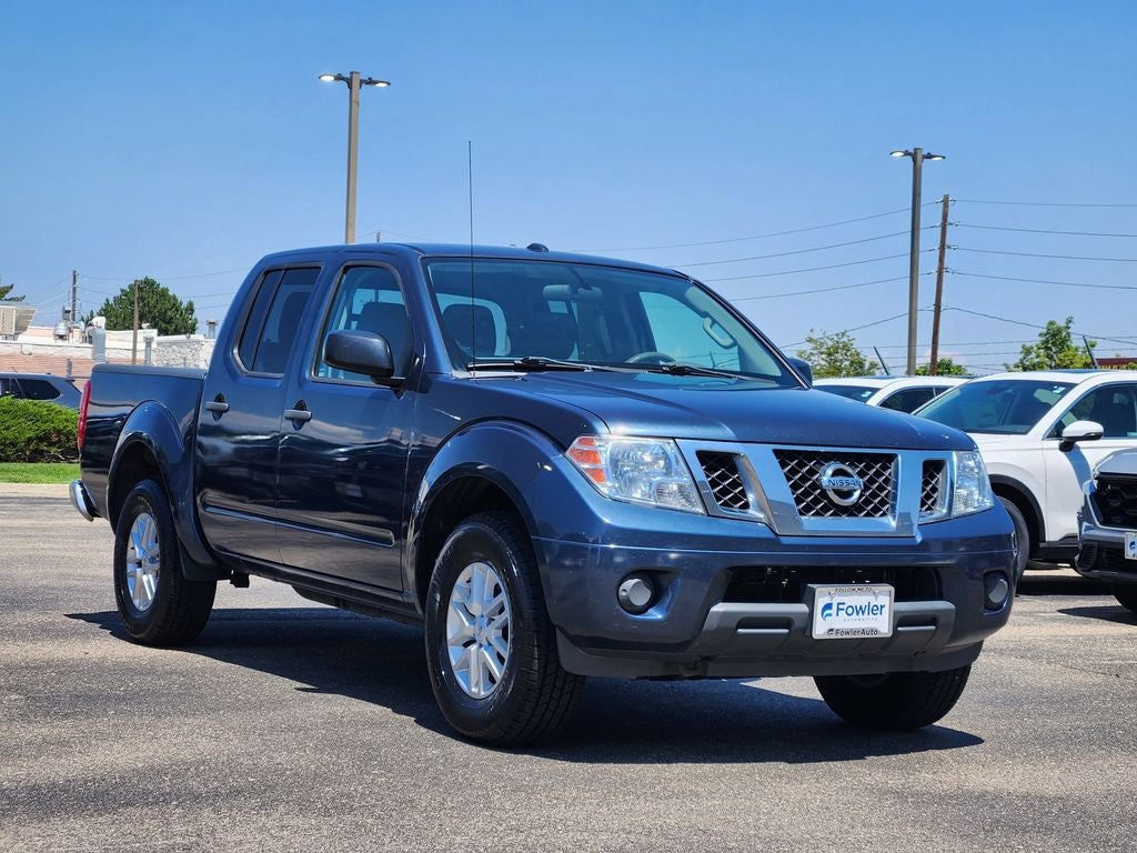 2016 Nissan Frontier SV in Arctic Blue Metallic — front three-quarter view