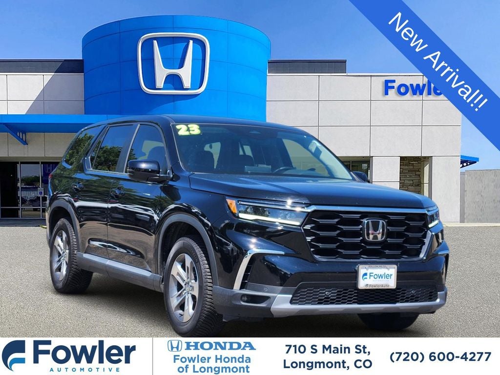 2023 Honda Pilot EX-L 7 Passenger in Crystal Black Pearl — front three-quarter view